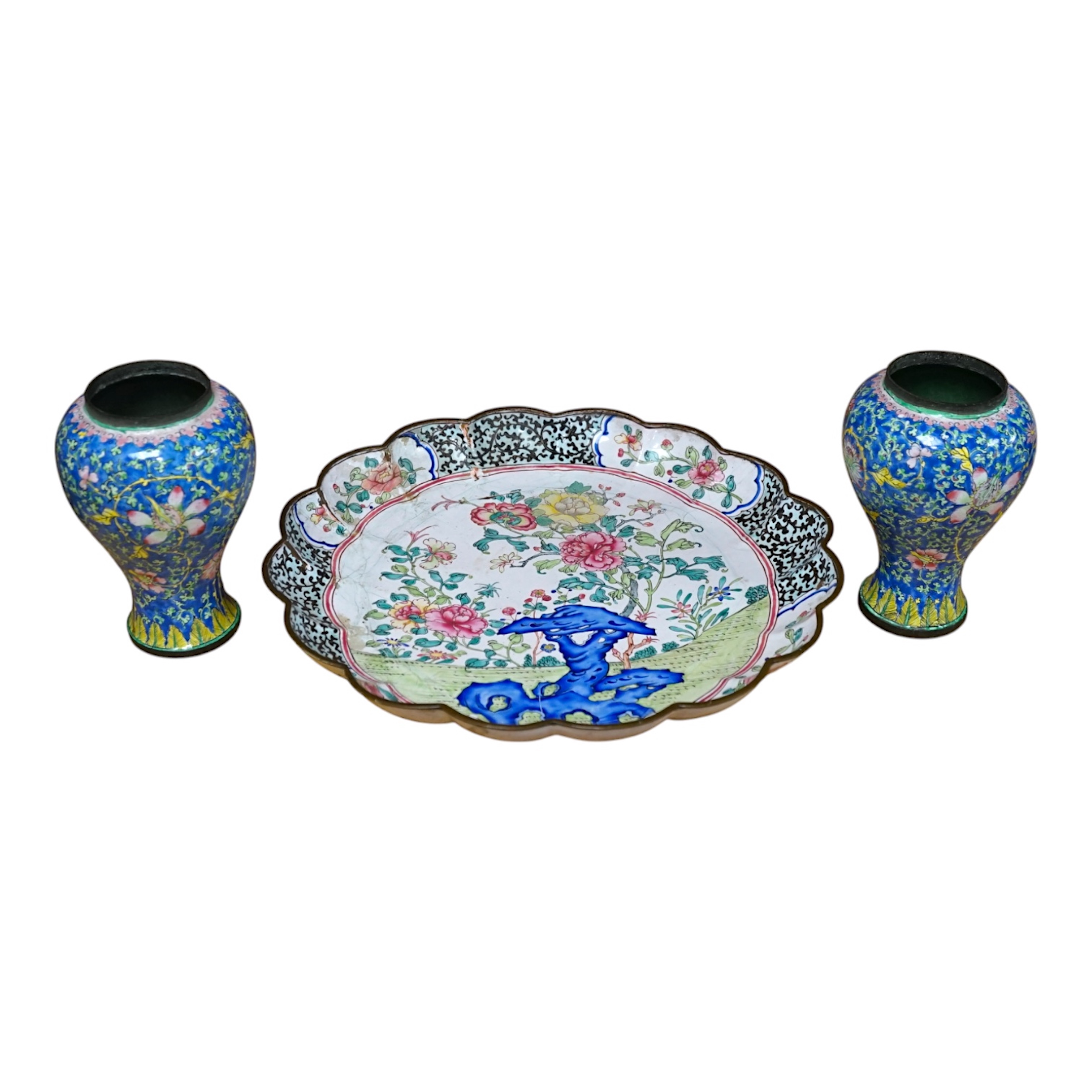 A pair of Chinese Guangzhou enamel vases, 19th century and an 18th century Guangzhou enamel dish, largest 26cm in diameter (3). Condition - fair